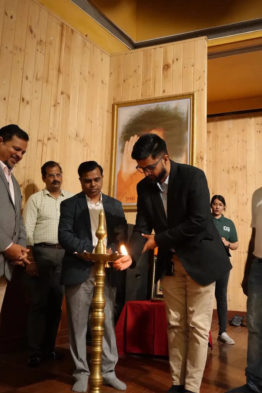 Guests lighting the ceremonial lamp to inaugurate the Recruitathon, with a DIYguru volunteer looking on